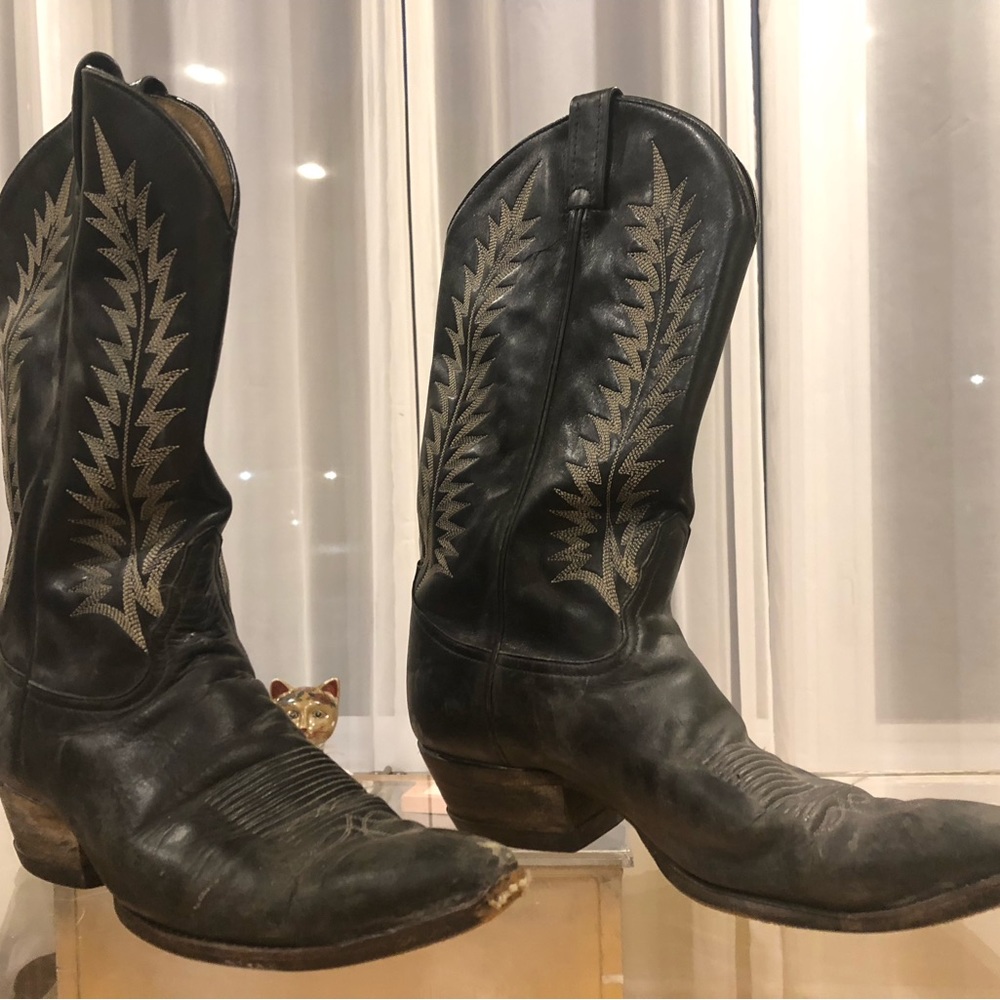 Leather Tony Lama Boots; Size 10. Worn with lots of old wear marks as pictured.